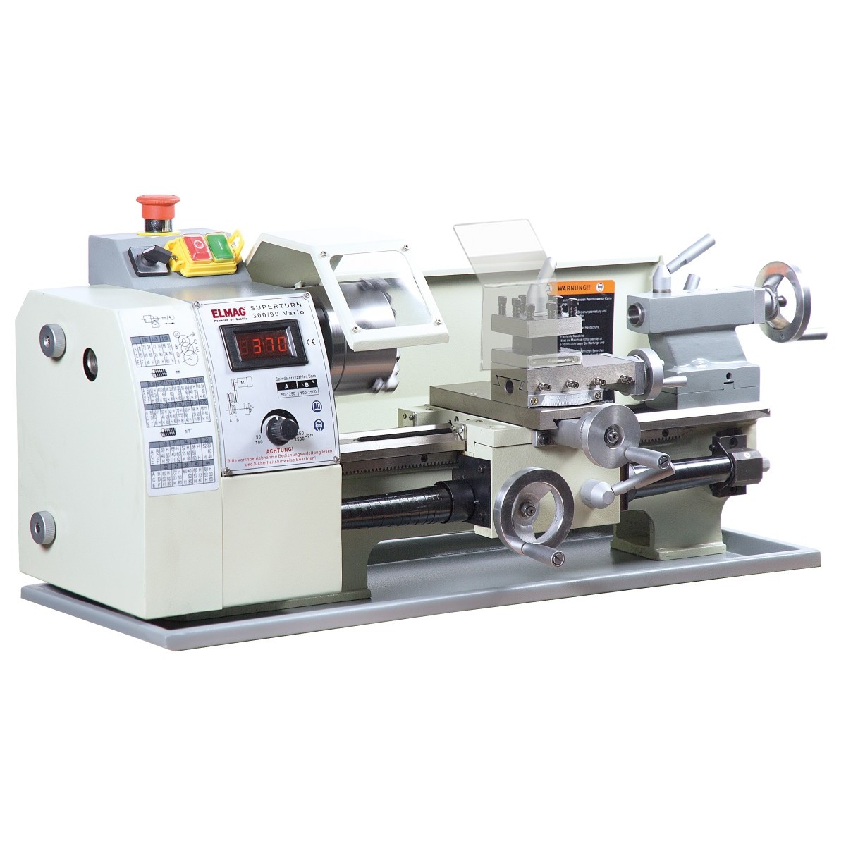 ELMAG Tischdrehmaschine mit Spindel, Werkzeughalter, Reitstock, Handrädern, Schutzhauben und Bedienfeld.
