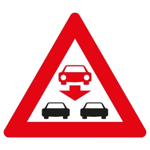 Verkehrsschild mit rotem Dreieck und Autosymbolen, das vor Falschfahrern auf der Straße warnt.