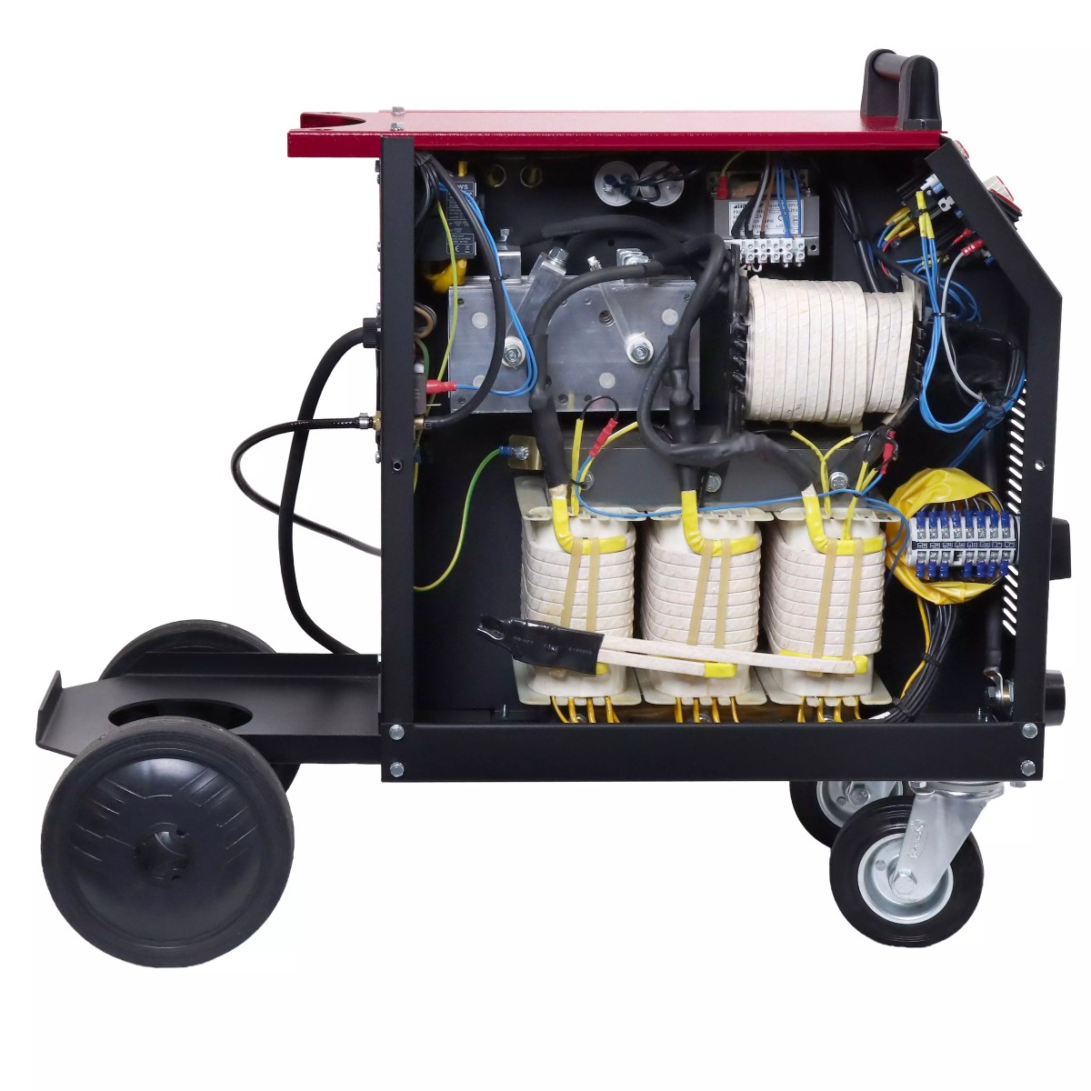 Schutzgas-Schweißanlage PM 2560T 4XL Geöffnetes Gerät: Innenansicht mit Spulen/Transformatoren, Kabeln und Klemmen; unten Fahrgestell mit Rädern.