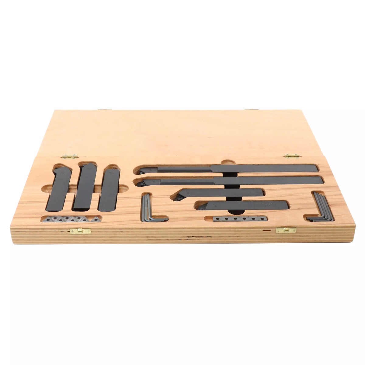 Drehmeißel-Set in geöffnetem Holzkoffer mit Werkzeughaltern, Wendeschneidplatten und Innensechskantschlüsseln.